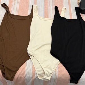 Set of Three Bodysuits - Brown, Cream, and Black